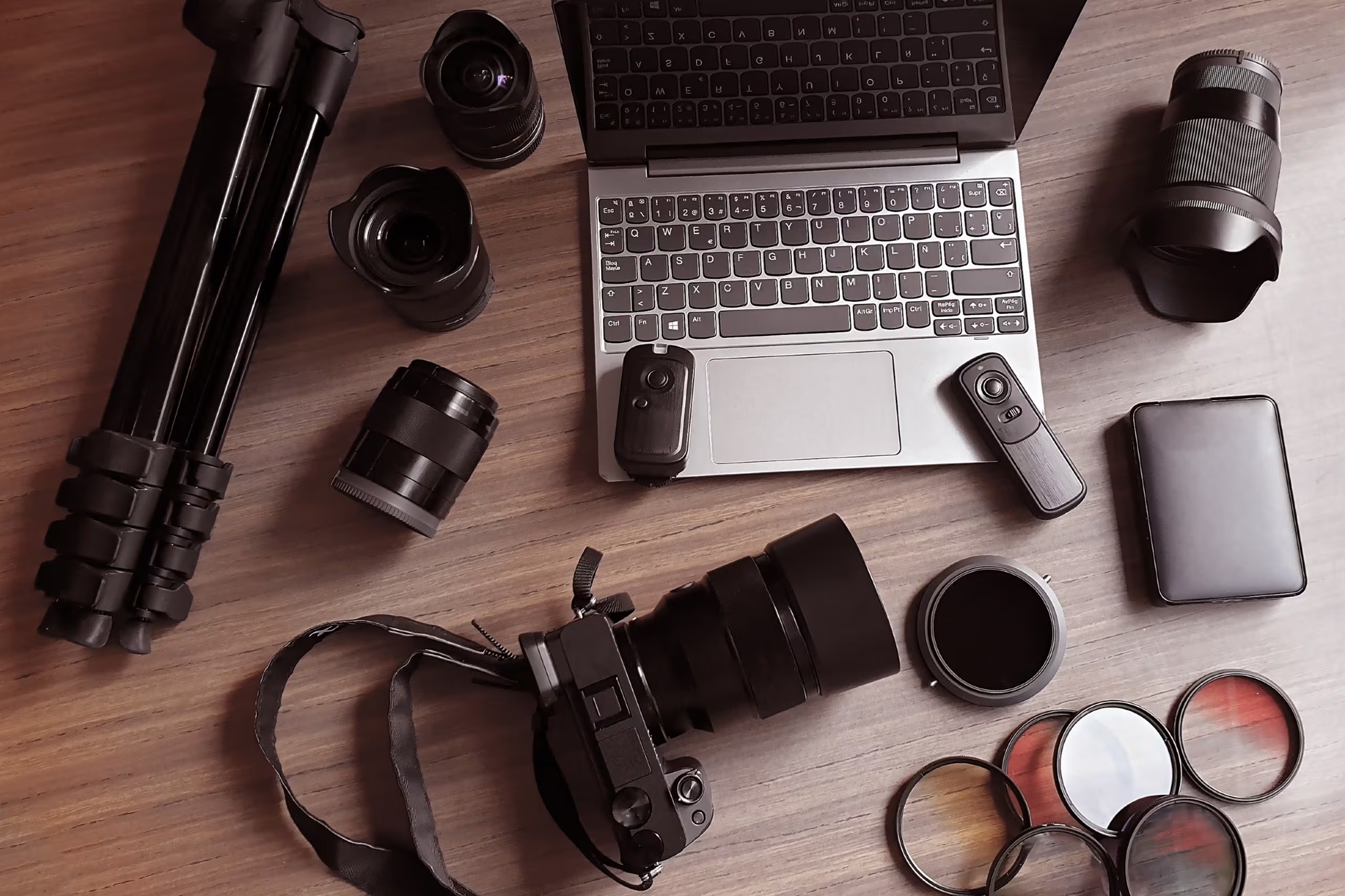 A collection of photography gear including camera and lenses